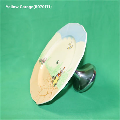 ヨーロッパで作られた陶器製プレートと金属脚を組み合わせたアンティークのケーキスタンド＿お皿左